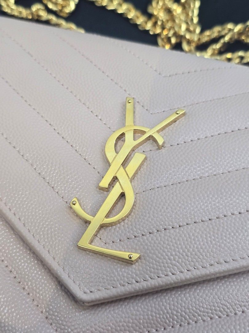 YSL Pale Pink Classic Cassandre Wallet on Chain (Category: Luxury Bags & Wallets) located in Taguig. Submitted by mluxeph (Listing ID 1452123730, Image 3). Description: YSL Pale Pink Classic Cassandre Wallet on Chain Material: Grained calfskin leather Stamp: HPF-377828-1222 Interior: Ten card slots, two gusseted compartment, one bills pocket, and one center zip coin pocket Measurements: 8.9”L X 1.5”W X 6”H Handle Drop: 19" Hardware: Gold tone Inc