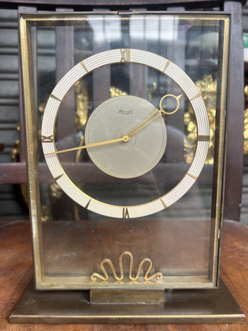 1950’s Vintage Kienzle Art Deco Table Clock, Germany (Category: Clocks) located in Makati City. Submitted by baliktanaw (Listing ID 1452375782, Image 1). Description: Vintage Kienzle Art Deco Table Clock. Made in Germany. In good working condition. Manual winding mechanism. Made of brass Height 22.5 cm.