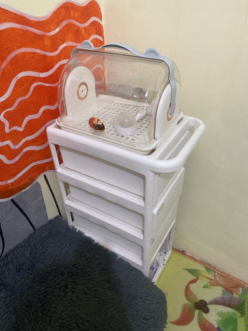 4+1 Layer Storage Cart with Wheels and Gifts (Category: Storage Boxes & Baskets) located in Naic. Submitted by potpott (Listing ID 1452427809, Image 3). Description: - Versatile 4+1 layer storage cart - Sturdy construction, holds up to 80kg - Dimensions: 36cm x 32cm x 87.5cm - Includes: Pegboard, 4 hooks, 2 baskets, 4 universal wheels - Bonus: Bottle storage box - Ideal for baby essentials or general household organization - Available in white an