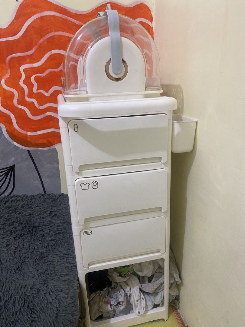 4+1 Layer Storage Cart with Wheels and Gifts (Category: Storage Boxes & Baskets) located in Naic. Submitted by potpott (Listing ID 1452427809, Image 2). Description: - Versatile 4+1 layer storage cart - Sturdy construction, holds up to 80kg - Dimensions: 36cm x 32cm x 87.5cm - Includes: Pegboard, 4 hooks, 2 baskets, 4 universal wheels - Bonus: Bottle storage box - Ideal for baby essentials or general household organization - Available in white an