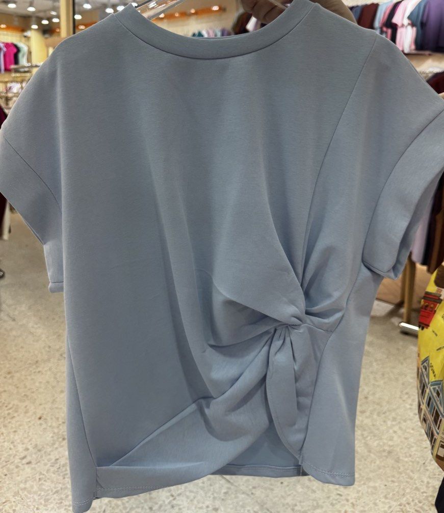 Mosaic Like Twisted Front Blouse from Bangkok (Multiple Colors Available) (Category: Blouses) located in Quezon City. Submitted by 0913cartz (Listing ID 1452370365, Image 1). Description: - Casual short-sleeve tee - Unique twisted knot detail on the front - Soft and comfortable fabric - Available colors: light blue, black, sage green, dark grey - Easy to pair with jeans or skirts - Ideal for everyday wear.