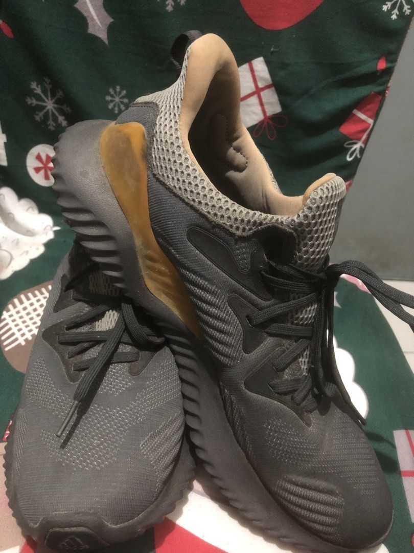 Adidas Alphabounce Running Shoes (Category: Activewear) located in Quezon City. Submitted by unique2shop (Listing ID 1452407779, Image 3). Description: - Adidas Alphabounce running shoes - Color: Dark grey with gold accents - Closure: Lace-up - Outsole: Continental rubber for excellent grip - Ideal for: Training or everyday wear - Condition: Shows some signs of wear on soles and uppers Need some cleaning Stored in cabinet for quite sometime MOP G