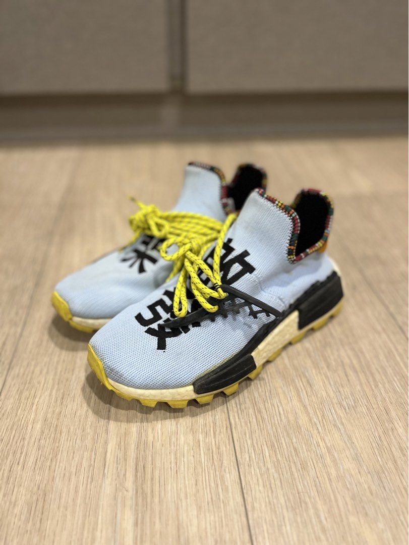 Adidas Pharrell Williams Human Race NMD 'Inspiration Pack' (Category: Sneakers) located in Manila. Submitted by oddpenguin.51b (Listing ID 1452460534, Image 2). Description: - Light blue Adidas Pharrell Williams Human Race NMD sneakers - Unique yellow laces - Black Chinese characters on the toe box - Colorful patterned heel collar lining - Original .