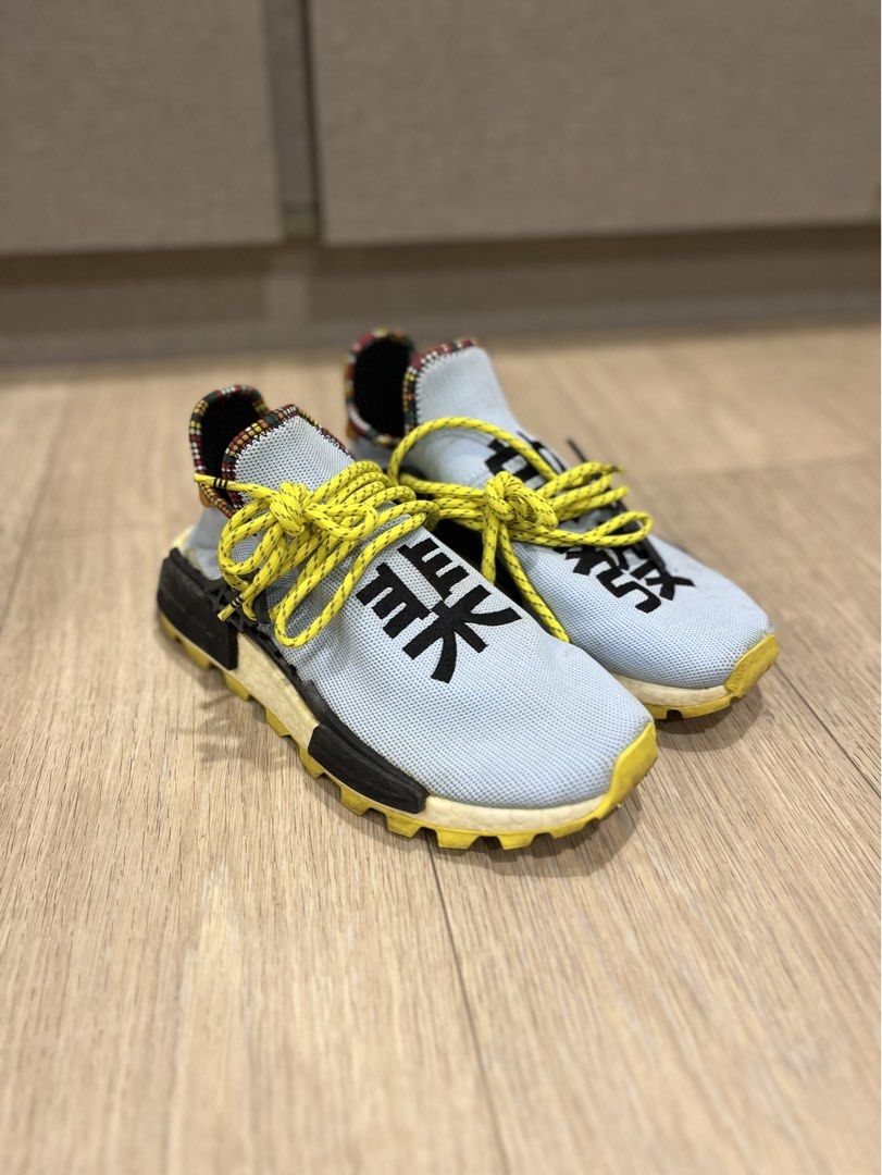 Adidas Pharrell Williams Human Race NMD 'Inspiration Pack' (Category: Sneakers) located in Manila. Submitted by oddpenguin.51b (Listing ID 1452460534, Image 3). Description: - Light blue Adidas Pharrell Williams Human Race NMD sneakers - Unique yellow laces - Black Chinese characters on the toe box - Colorful patterned heel collar lining - Original .