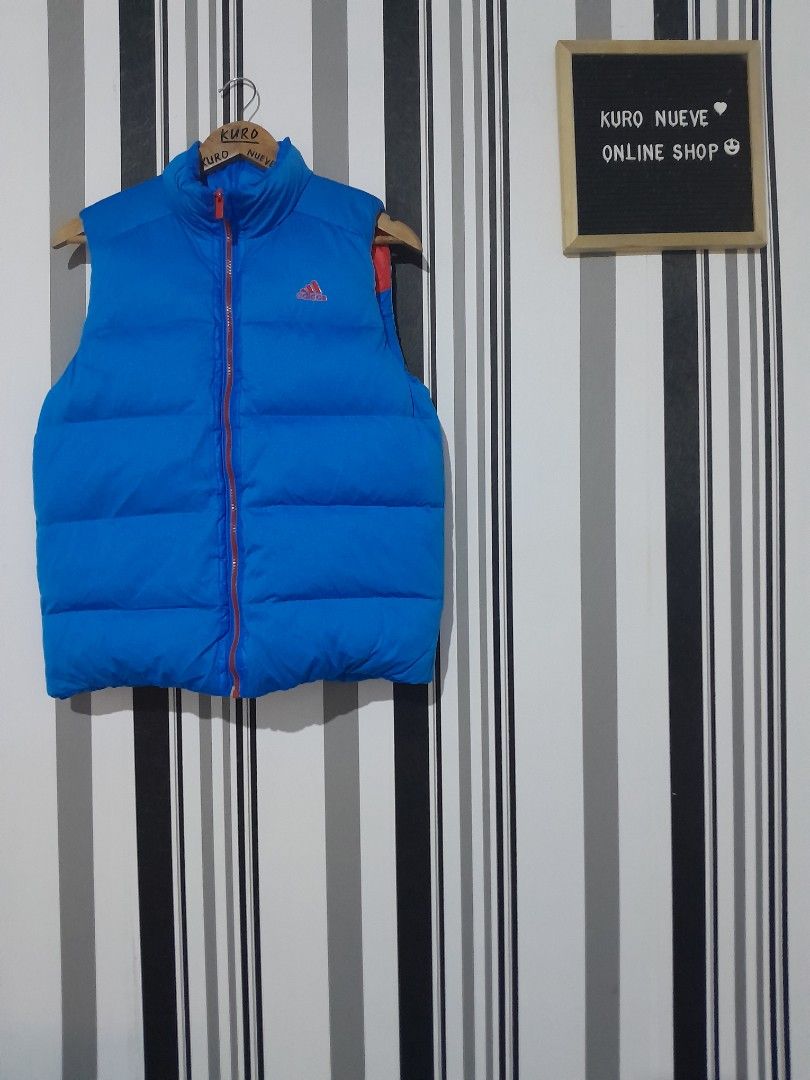 Adidas Puffer Vest Blue Green Red (Category: Vests) located in Lucena. Submitted by kuronueve0909 (Listing ID 1452445710, Image 1). Description: Adidas puffer vest Waterproof Reversible Size: medium Width: 20.5 Length: 25 Price: ₱999 No issue ✅️ Ready to wear ✅️ Dm 📩 .