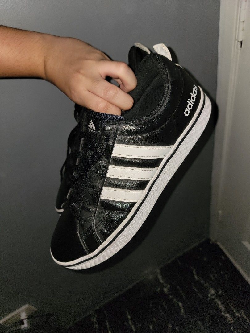 Adidas shoes men ORIGINAL (Category: Casual Shoes) located in Manila. Submitted by knzou (Listing ID 1452346634, Image 3). Description: size us 9 men first owner, not buy and sell issue: may unting gasgas sa right na shoe sa harapan, other than that almost brand new condition - Classic black Adidas sneakers - Iconic white stripes - Low-top design - White sole - Red rubber outsole for enhanced grip - Black laces - Ideal for casual wear and sports 