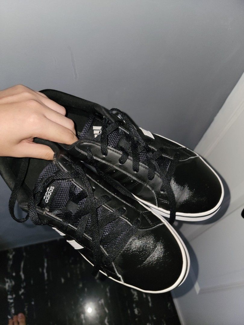 Adidas shoes men ORIGINAL (Category: Casual Shoes) located in Manila. Submitted by knzou (Listing ID 1452346634, Image 2). Description: size us 9 men first owner, not buy and sell issue: may unting gasgas sa right na shoe sa harapan, other than that almost brand new condition - Classic black Adidas sneakers - Iconic white stripes - Low-top design - White sole - Red rubber outsole for enhanced grip - Black laces - Ideal for casual wear and sports 