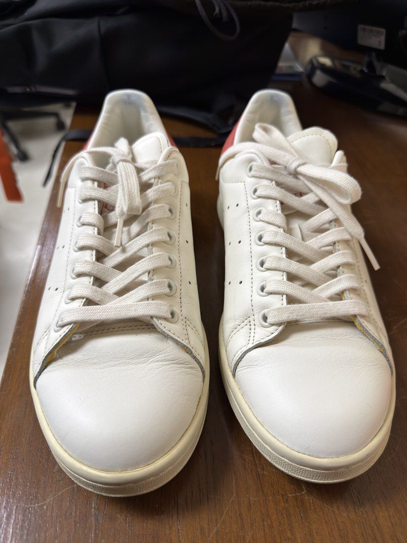 Adidas Stan Smith White Orange Leather Sneakers (Category: Sneakers) located in Pasay City. Submitted by markacesantos (Listing ID 1452332389, Image 2). Description: - Classic Adidas Stan Smith sneakers - Color: White leather with orange accents on heel tab - Iconic perforated 3-Stripes detail - Lace-up closure for a secure fit - Comfortable for everyday wear - Size: 8 US Men’s - Newly Cleaned (Laundry ni Juan worth PHP 550).
