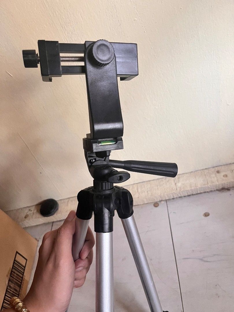Adjustable Tripod with Phone Holder (Category: Tripods & Monopods) located in Bulacan. Submitted by decluttermeans (Listing ID 1452370665, Image 2). Description: Rfs: Decluttering LOC: San Jose Del Monte, Bulacan ΜΟΡ: Gcash/PayMava MOD: J&T (delivery fee is shouldered by the buyer) Can do meetup (Starmall & SM tungko) PM me for inquiries.