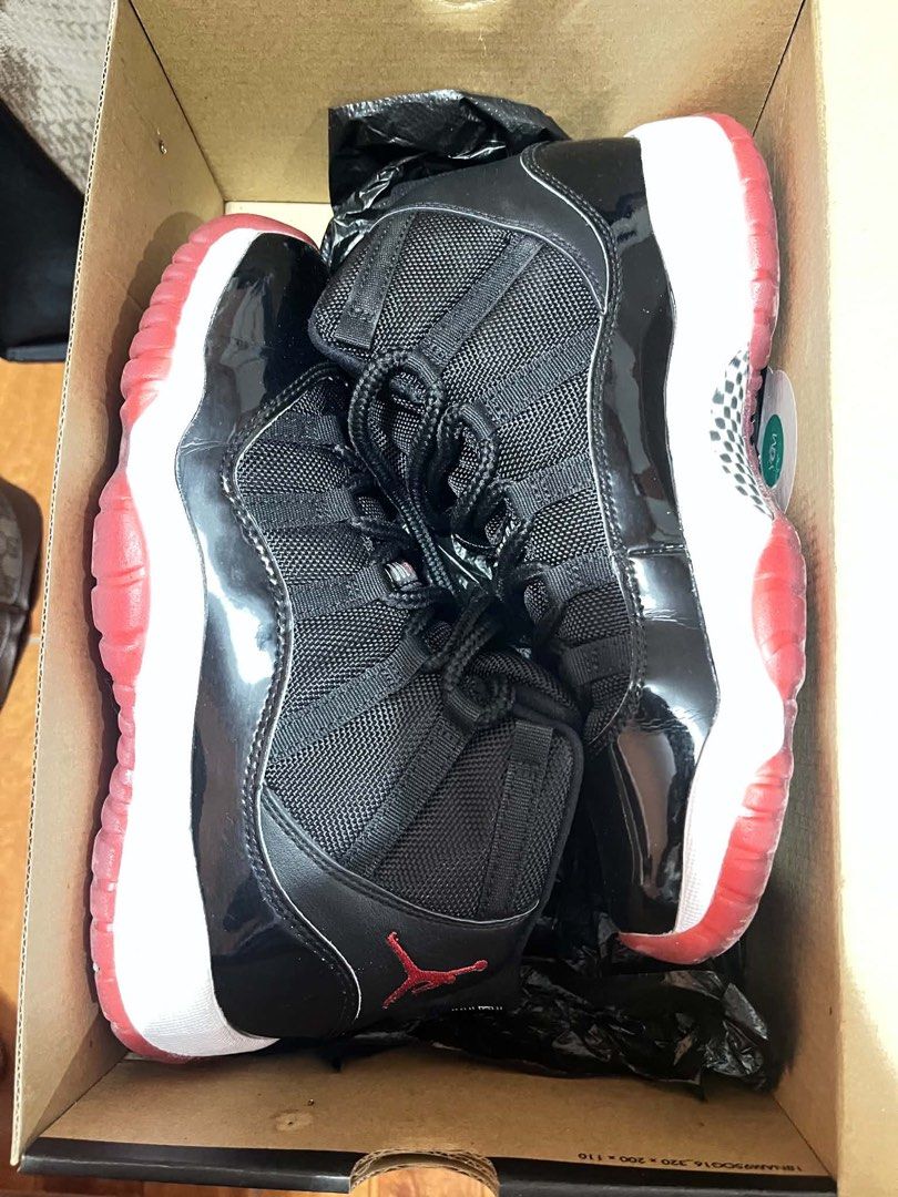 Air Jordan 11 Retro Black Red Concord (Category: Sneakers) located in Dasmarinas. Submitted by rinz0man (Listing ID 1452469852, Image 1). Description: - Classic Air Jordan 11s in black and red. - Iconic patent leather and mesh upper. - Red translucent outsole. - Jumpman logo detail. - Comes with original box. - A must-have for any sneaker collection. - size 7y female or 25cm 8women.