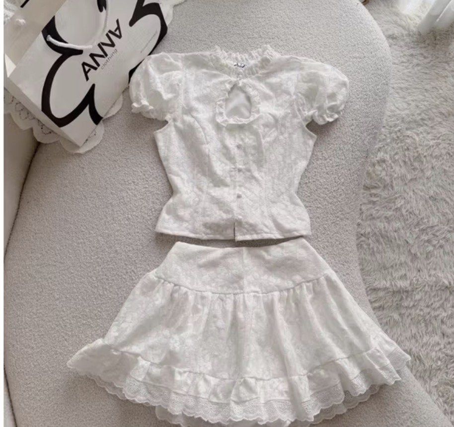 Anna Clothing (Vietnam) Roby White Set (Category: Sets or Coordinates) located in Malolos. Submitted by peonyprincess (Listing ID 1452482797, Image 1). Description: - Adorable white lace set - Puff sleeve top with a chic keyhole neckline - Matching ruffled mini skirt with delicate lace trim - Perfect for summer outings or special occasions - Exudes a sweet and feminine vibe.