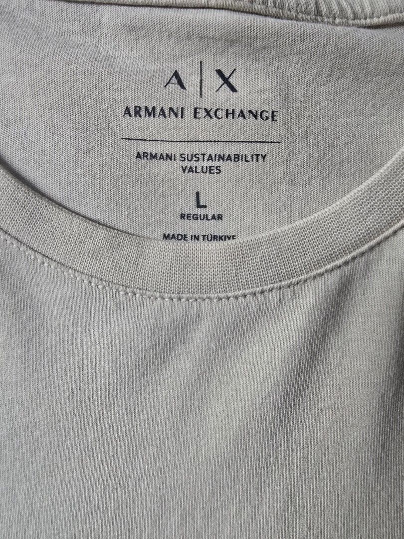 Armani Exchange AX T-Shirt Size L (Category: Tshirts & Polo Shirts ) located in Quezon City. Submitted by jb0516 (Listing ID 1452462053, Image 3). Description: - Cream colored Armani Exchange t-shirt - Features a raised AX logo on the front - Made in Turkey - Size: Large (L) - Fit: Regular - Ideal for casual wear.