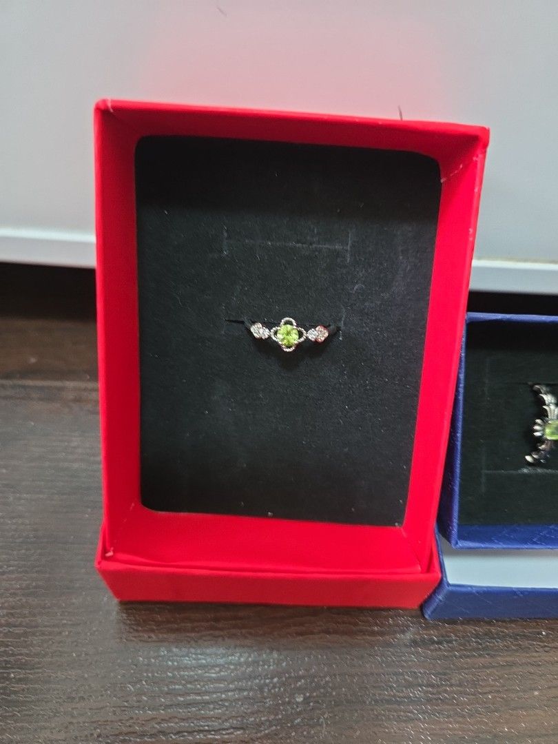 Assorted Ring (Category: Necklaces) located in Singapore. Submitted by draven23 (Listing ID 1452357487, Image 2). Description: - Beautiful Peridot and Diamond Ring & Necklace Set - Ring features a clover design with green stone and small diamonds - Necklace has a rectangular pendant with green stone and diamonds - Both pieces come in their original boxes - Ideal for gifting or personal indulgence - Not sure made of what, not for fussy who wants r