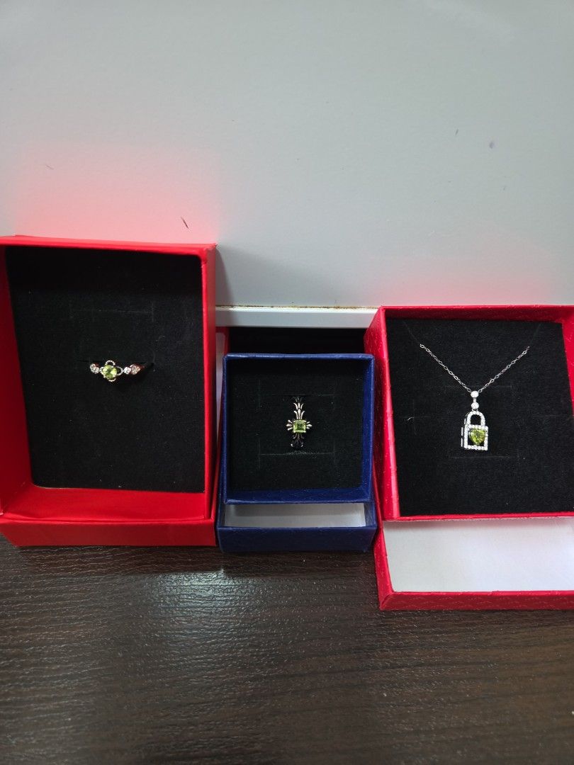 Assorted Ring (Category: Necklaces) located in Singapore. Submitted by draven23 (Listing ID 1452357487, Image 1). Description: - Beautiful Peridot and Diamond Ring & Necklace Set - Ring features a clover design with green stone and small diamonds - Necklace has a rectangular pendant with green stone and diamonds - Both pieces come in their original boxes - Ideal for gifting or personal indulgence - Not sure made of what, not for fussy who wants r