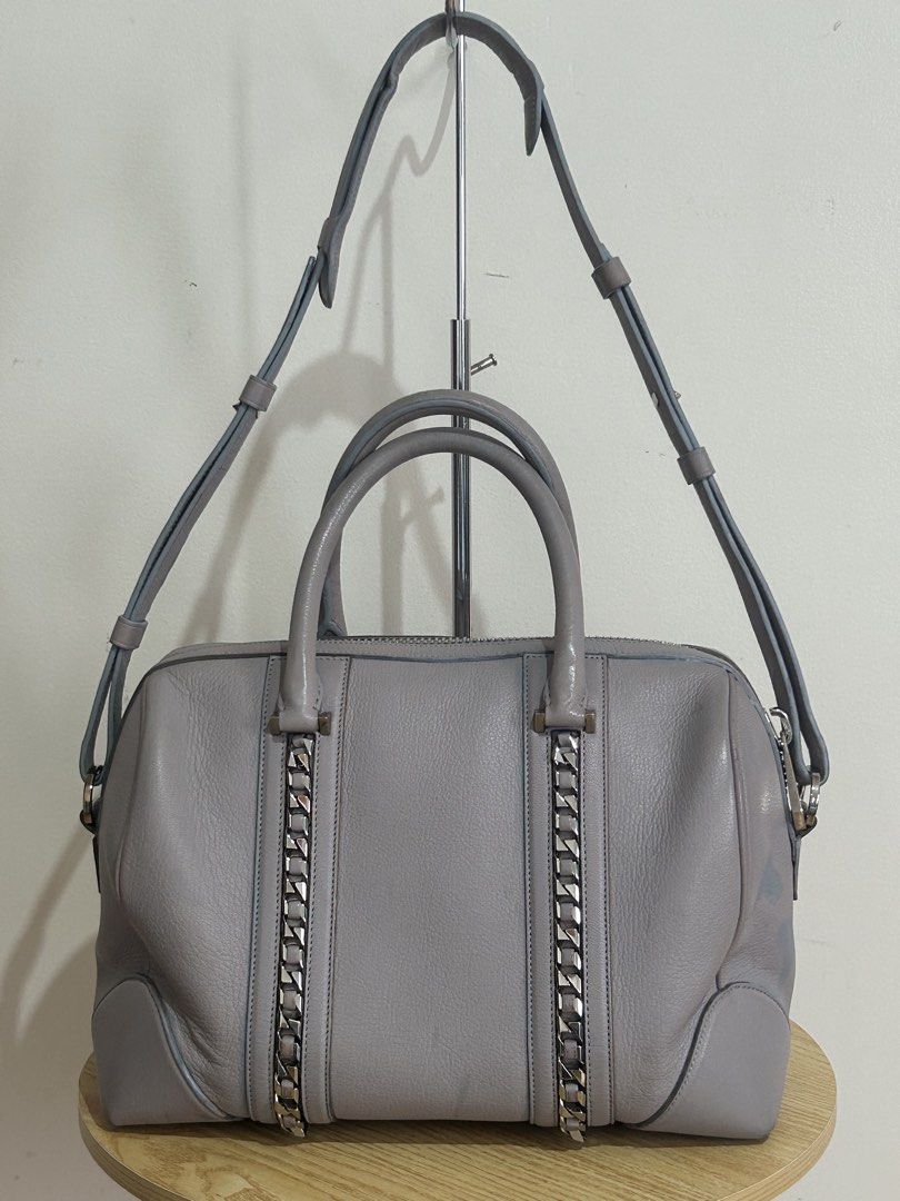 Authentic GIVENCHY LUCREZIA Medium 2-way Bag RECOLORED (Category: Luxury Bags & Wallets) located in Las Pinas. Submitted by jc_closet (Listing ID 1452413511, Image 2). Description: 💯 Authentic or Money Back Condition : 8/10 Clean Interior Flaw : Recolored Body of bag, Handles and Strap gum lining. Rubs on all corners Bawal po sa Maselan!!! Color : Gray with Chain Detail Dimensions and Features Length: 12.75 in (32.5 cm) Width/Depth: 7 to 8 in (1