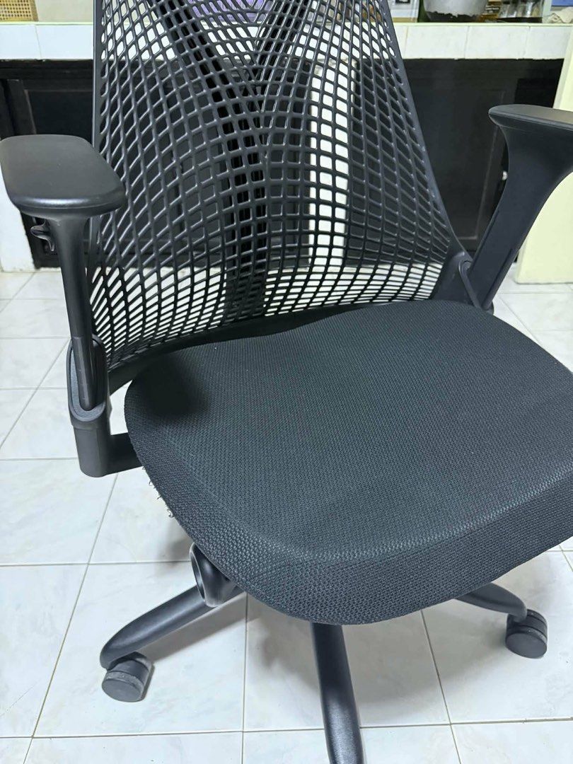 Authentic Herman Miller Sayl Chair (Category: Office Furniture & Fixtures) located in Manila. Submitted by jason_lt (Listing ID 1452342319, Image 3). Description: - *Fabric Seat*: Breathable and comfortable - *Ventilated Elastomer Backrest*: Provides targeted support and ventilation - *Adjustable Height and Armrests*: Allows for customized fit and comfort - *Synchronized Tilt and Lock*: Enables reclining and locking in place - *Additional Feature
