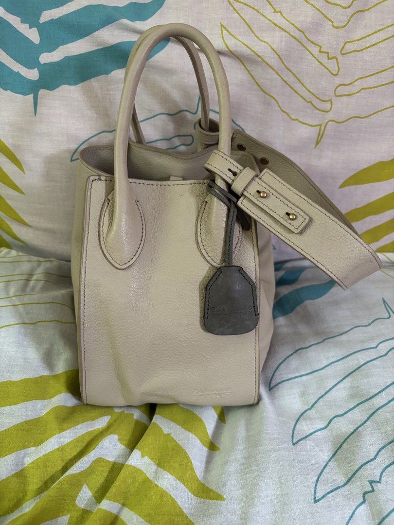 AUTHENTIC RABEANCO: LU TOP HANDLE BAG (Category: Luxury Bags & Wallets) located in Manila. Submitted by danidanidani213 (Listing ID 1452497239, Image 2). Description: LU Top Handle Bag Cream beige Original price: 18,000 - Grained cow leather boxy-shaped top handle bag - Styling by top clipper closure - Elegant dual rolled leather handles - With slip pocket and zipper compartment - Adjustable and detachable bold bridge strap 21(W) x 20.5(H) x 15(D