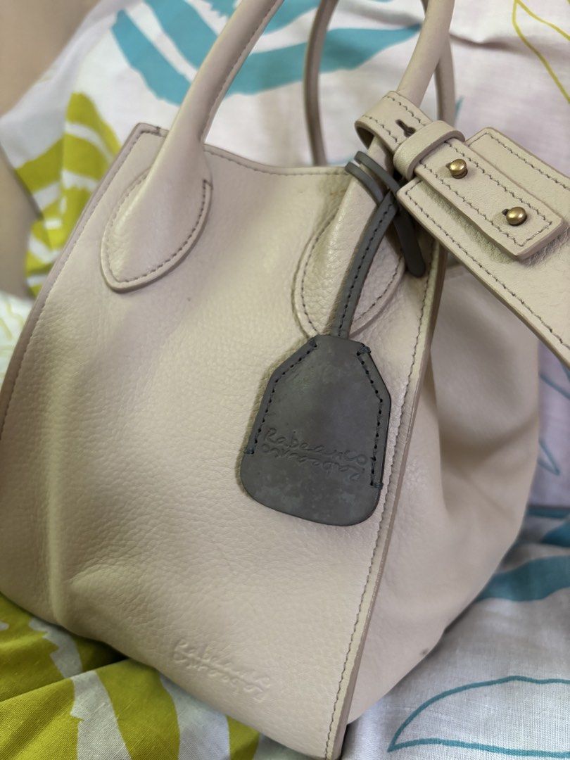 AUTHENTIC RABEANCO: LU TOP HANDLE BAG (Category: Luxury Bags & Wallets) located in Manila. Submitted by danidanidani213 (Listing ID 1452497239, Image 1). Description: LU Top Handle Bag Cream beige Original price: 18,000 - Grained cow leather boxy-shaped top handle bag - Styling by top clipper closure - Elegant dual rolled leather handles - With slip pocket and zipper compartment - Adjustable and detachable bold bridge strap 21(W) x 20.5(H) x 15(D