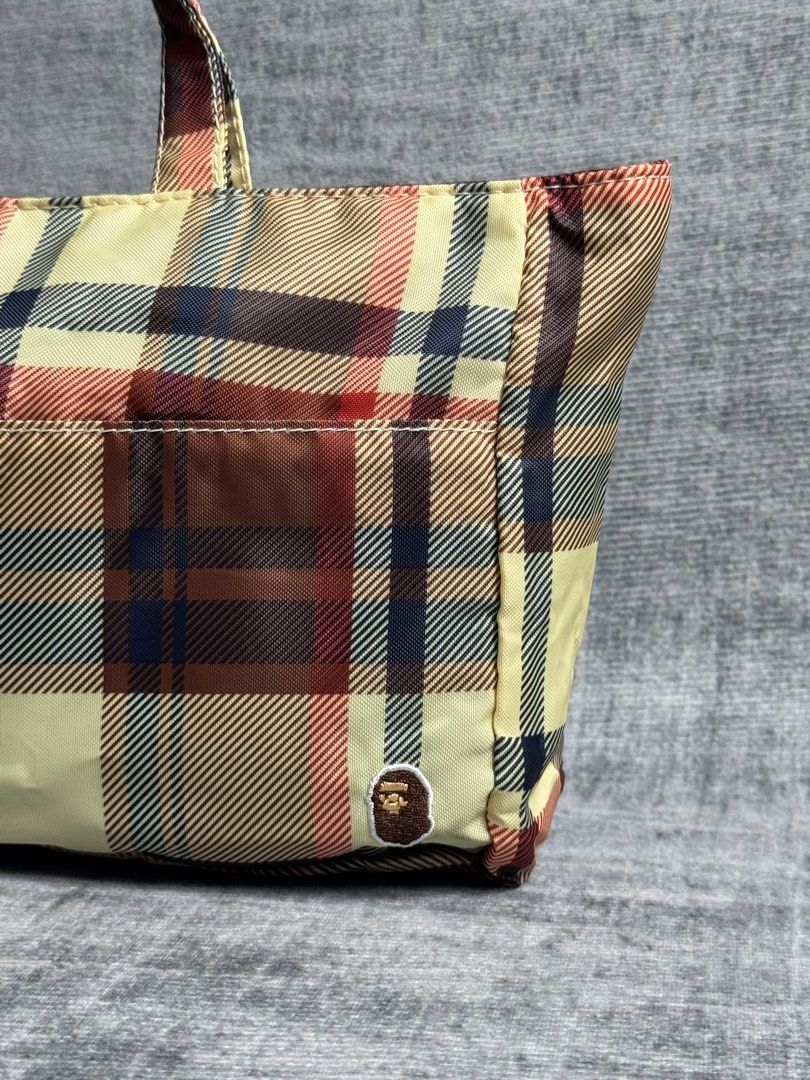 Bape - Plaid Mini Tote Bag - Burberry Style (Category: Belt bags, Clutches and Pouches) located in Manila. Submitted by members-only (Listing ID 1452447026, Image 2). Description: Bape Mini Tote Bag Plaid style like burberry Very good condition No issue 💯Authentic Can fit your cellphone wallet keys and others.