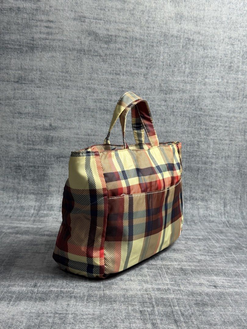 Bape - Plaid Mini Tote Bag - Burberry Style (Category: Belt bags, Clutches and Pouches) located in Manila. Submitted by members-only (Listing ID 1452447026, Image 3). Description: Bape Mini Tote Bag Plaid style like burberry Very good condition No issue 💯Authentic Can fit your cellphone wallet keys and others.