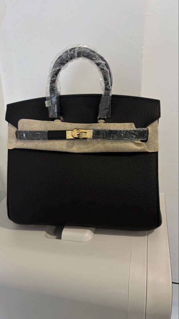 BIRKIN 25 (Category: Bags & Wallets) located in Kuala Lumpur. Submitted by misstrendy (Listing ID 1452386748, Image 1). Description: - Brand: Hermes - Model: Birkin 25 - Color: Black - Material: Pebbled Leather - Hardware: Gold - Condition: Excellent (as pictured) - Size: 25cm - Meetup Location: Ampang Point Shopping Centre, Selangor.