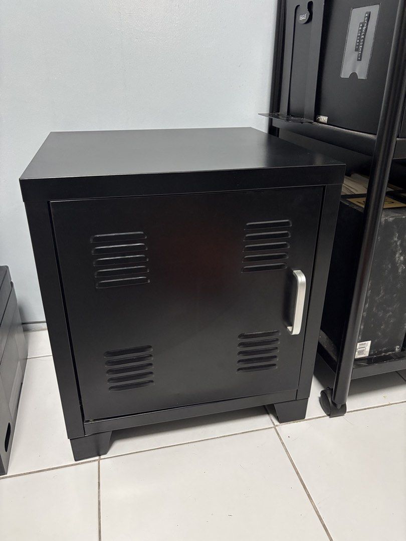 Black Metal Locker Style Cabinet with Shelf (Category: Shelves, Cabinets & Racks) located in Antipolo. Submitted by dddeclutter (Listing ID 1452406816, Image 1). Description: - Sleek black metal cabinet - Locker-style door with silver handle and vents - Includes one internal shelf for storage - Compact size, ideal for bedrooms, offices, or dorm rooms - Clean and simple design, fits most spaces.