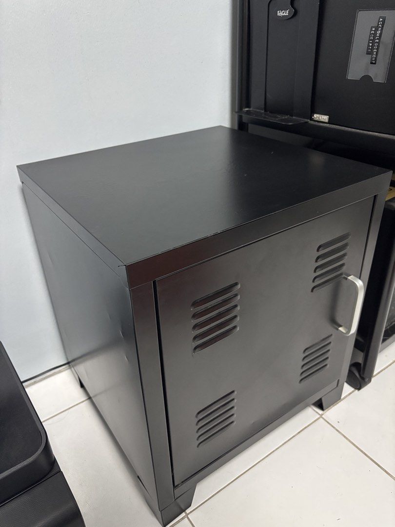 Black Metal Locker Style Cabinet with Shelf (Category: Shelves, Cabinets & Racks) located in Antipolo. Submitted by dddeclutter (Listing ID 1452406816, Image 2). Description: - Sleek black metal cabinet - Locker-style door with silver handle and vents - Includes one internal shelf for storage - Compact size, ideal for bedrooms, offices, or dorm rooms - Clean and simple design, fits most spaces.