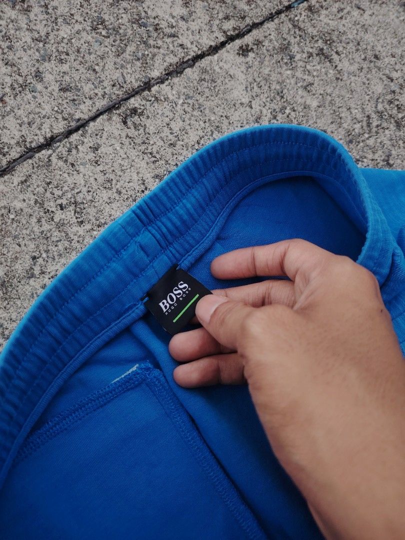 BOSS Hugo Boss Blue Sweat Shorts (Category: Shorts) located in Calapan. Submitted by thriftopia_12 (Listing ID 1452448015, Image 1). Description: - Blue BOSS Hugo Boss sweat shorts - Elastic waistband with drawstring - Two side pockets - Comfortable material for lounging or casual wear - Great for everyday use.