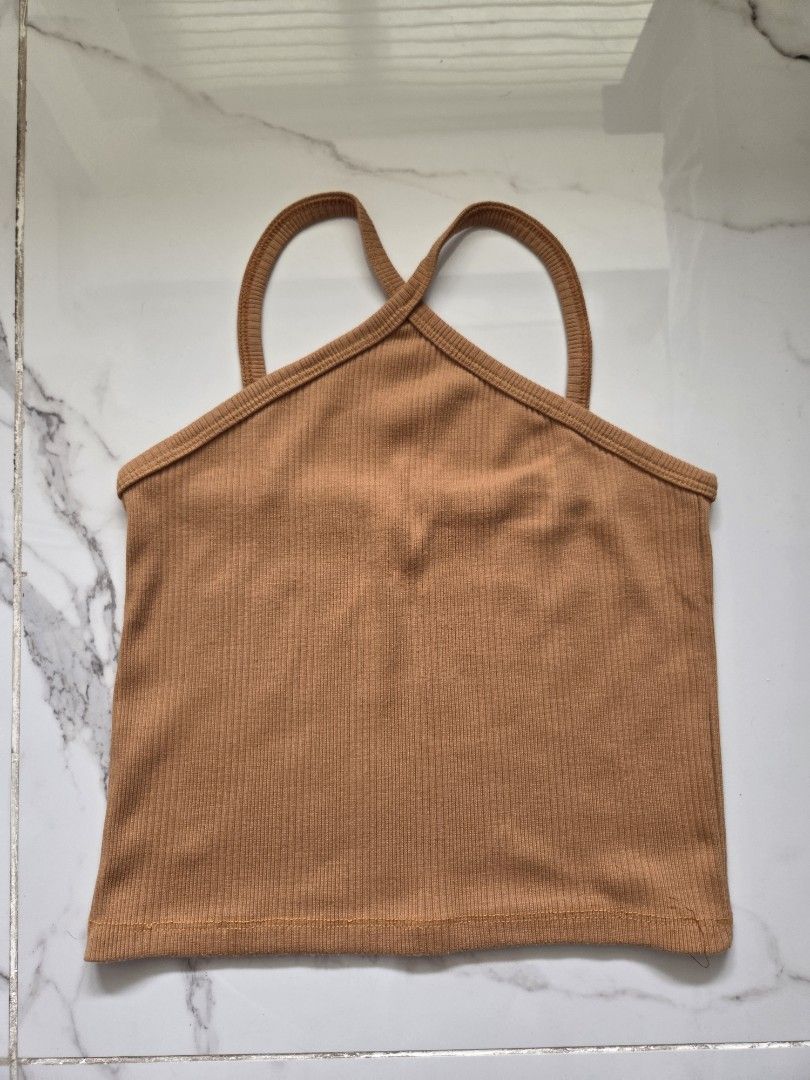 Brown Ribbed Halter Tank Top (Category: Sleeveless) located in Manila. Submitted by weirdlysa (Listing ID 1452375817, Image 1). Description: - halter neck tank top with spaghetti straps - brown color - ribbed, stretchy material - fits women's size S - simple basics.