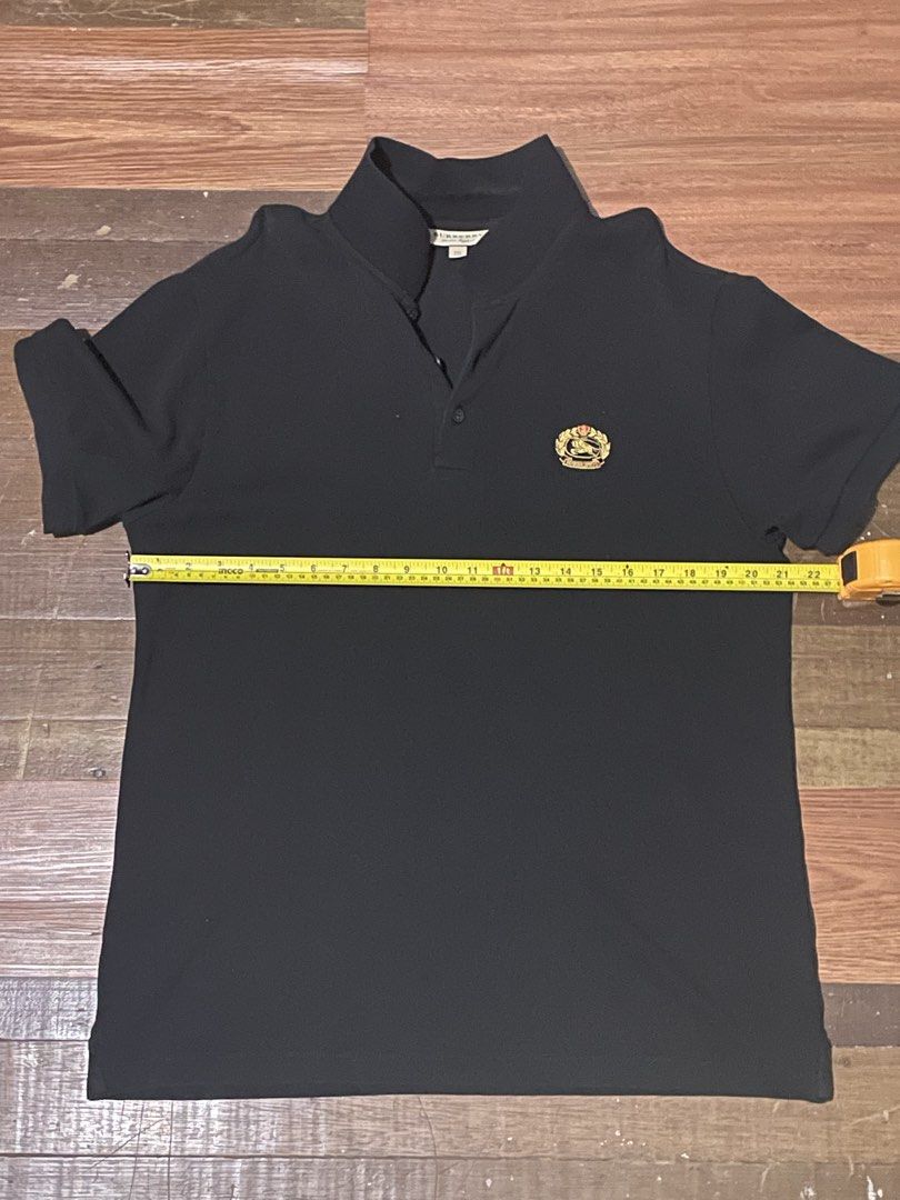 Burberry Black Polo Shirt (Category: Tshirts & Polo Shirts ) located in Angeles City. Submitted by caerus8 (Listing ID 1452420002, Image 1). Description: Negotiable. Decluttering old (now too big for me) clothes..
