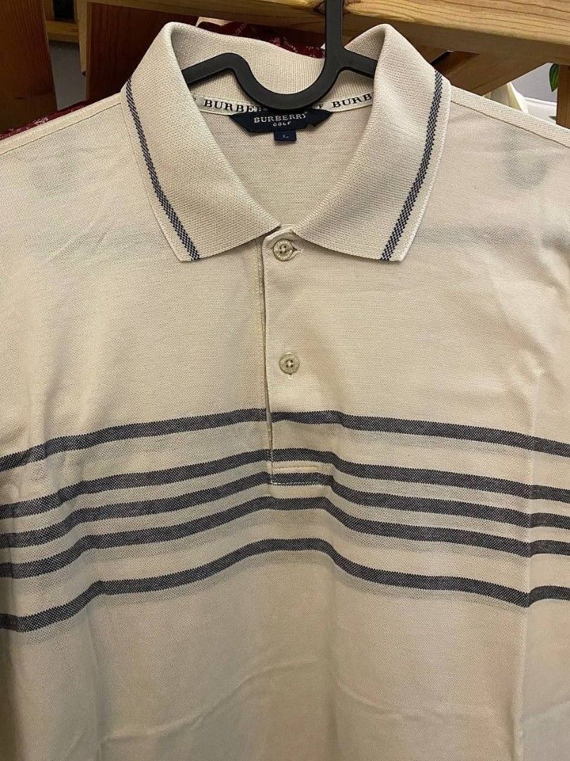 Burberry Golf Polo Tee (Category: Tshirts & Polo Shirts) located in Tanjung Tokong. Submitted by grandbundle (Listing ID 1452381153, Image 2). Description: Burberry Golf Polo Tee (B95) Condition: Like New Size: L (P:22, L:27) Price: RM60.00 GOOD SOLD ARE NOT RETURNABLE, REFUNDABLE AND EXCHANGEABLE.