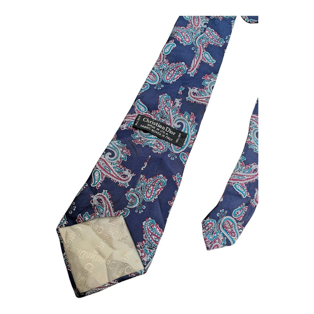 Christian Dior Silk Paisley Tie (Category: Ties) located in Taguig. Submitted by jeffreydes45725 (Listing ID 1452350134, Image 2). Description: - Authentic Christian Dior tie - Color: Navy blue base - Pattern: Paisley in pink, red, and blue - Material: 100% Silk - Origin: Made in Italy - Style: Classic, elegant, perfect for formal or smart-casual wear.