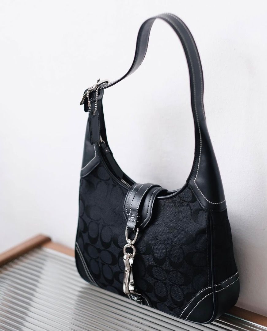 SOLD‼️Coach Black Hampton Shoulder Bag (Category: Shoulder Bags) located in Dagupan City. Submitted by emmanreyes (Listing ID 1452438994, Image 1). Description: - Brand: Coach - Model: Hampton Shoulder Bag - Color: Black - Material: Signature canvas with leather trim - Design: Classic shoulder bag style with white stitching details - Features: Versatile for everyday use.