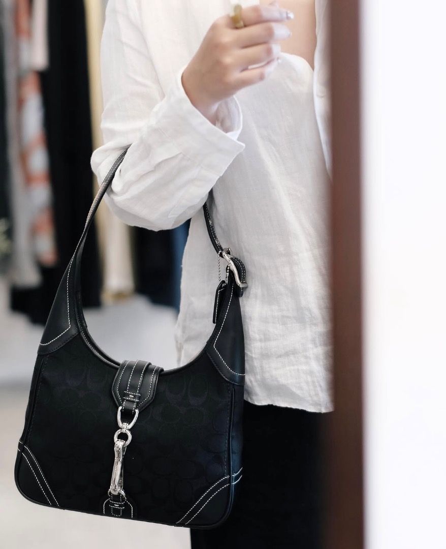 SOLD‼️Coach Black Hampton Shoulder Bag (Category: Shoulder Bags) located in Dagupan City. Submitted by emmanreyes (Listing ID 1452438994, Image 2). Description: - Brand: Coach - Model: Hampton Shoulder Bag - Color: Black - Material: Signature canvas with leather trim - Design: Classic shoulder bag style with white stitching details - Features: Versatile for everyday use.