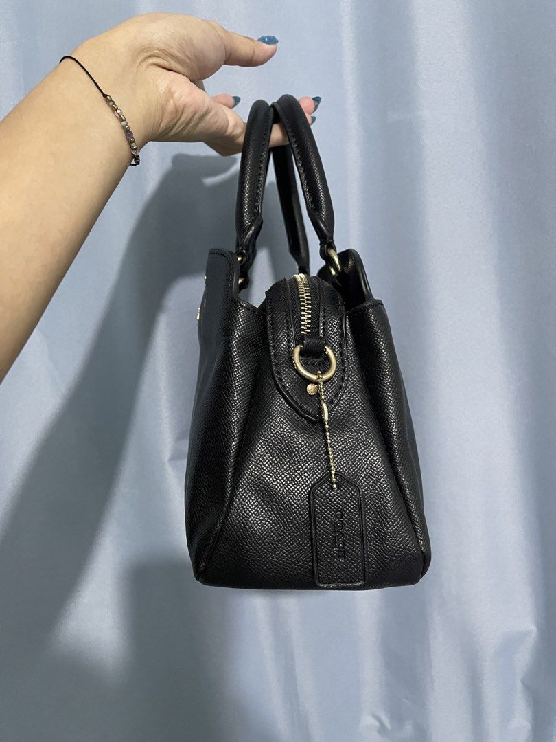 Coach Mini Lillie Carryall (Category: Luxury Bags & Wallets) located in Cavite. Submitted by lengthingz (Listing ID 1452451920, Image 3). Description: - Classic black Coach satchel - Gold hardware details - Top handles - Zip closure - Includes Coach hangtag - Spacious interior - Ideal for everyday use.