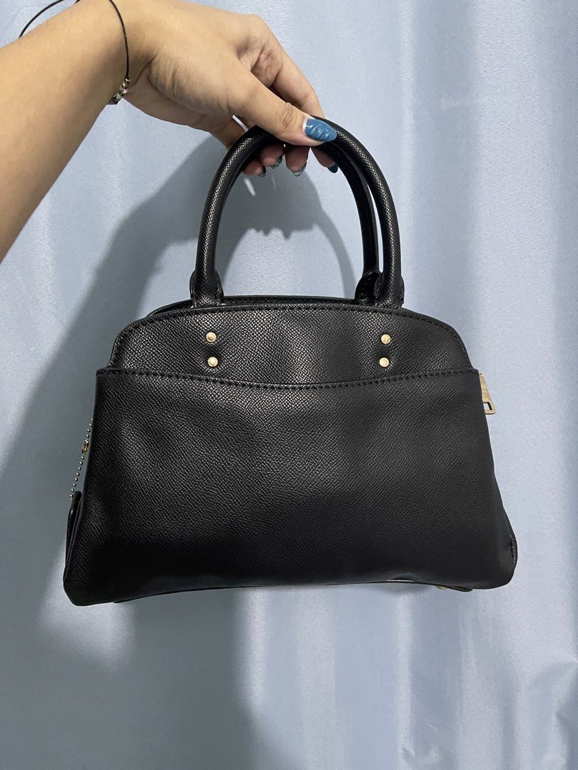 Coach Mini Lillie Carryall (Category: Luxury Bags & Wallets) located in Cavite. Submitted by lengthingz (Listing ID 1452451920, Image 2). Description: - Classic black Coach satchel - Gold hardware details - Top handles - Zip closure - Includes Coach hangtag - Spacious interior - Ideal for everyday use.