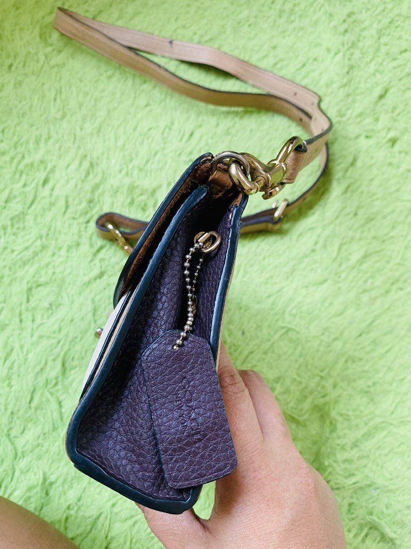 Coach Signature Monogram Crossbody Bag (Category: Luxury Bags & Wallets) located in San Jose del Monte. Submitted by jmjm16 (Listing ID 1452359058, Image 3). Description: - preloved Coach crossbody bag - Signature monogram print in tan and cream color - Adjustable strap -leather trim and details **no etiketa & creed inside **May natanggal na rubberlining sa gilid **May maliit na pen mark sa sling **some fadings on hardware.