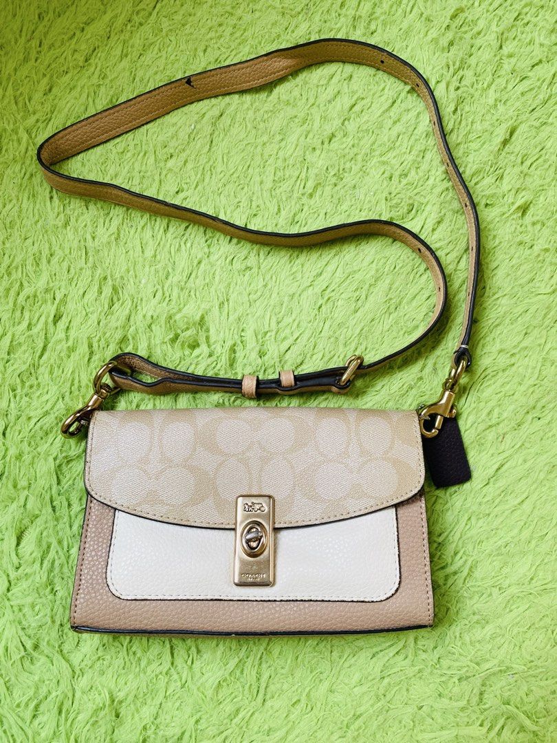 Coach Signature Monogram Crossbody Bag (Category: Luxury Bags & Wallets) located in San Jose del Monte. Submitted by jmjm16 (Listing ID 1452359058, Image 1). Description: - preloved Coach crossbody bag - Signature monogram print in tan and cream color - Adjustable strap -leather trim and details **no etiketa & creed inside **May natanggal na rubberlining sa gilid **May maliit na pen mark sa sling **some fadings on hardware.