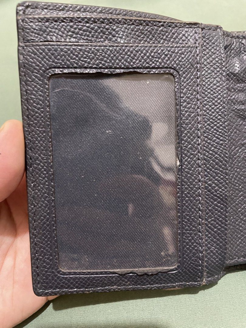 Coach Trifold Wallet Blue and Black Leather (Category: Wallets & Card holders) located in Mabalacat. Submitted by mnaniii (Listing ID 1452372680, Image 3). Description: - Coach trifold wallet - Blue and black pebbled leather - Multiple card slots - Clear ID window - Interior zippered coin pocket - Signs of wear on interior, particularly coin pocket area - Plenty of life remaining Delivery Meet up ( if around bulacan) .