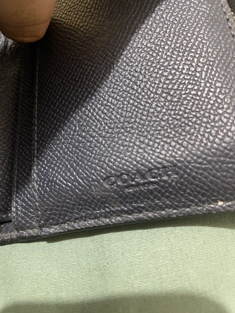 Coach Trifold Wallet Blue and Black Leather (Category: Wallets & Card holders) located in Mabalacat. Submitted by mnaniii (Listing ID 1452372680, Image 2). Description: - Coach trifold wallet - Blue and black pebbled leather - Multiple card slots - Clear ID window - Interior zippered coin pocket - Signs of wear on interior, particularly coin pocket area - Plenty of life remaining Delivery Meet up ( if around bulacan) .