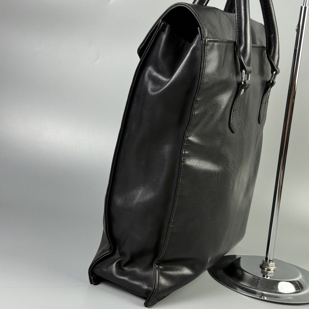 Comme des Garcons - Soft Leather Tote Bag (Category: Tote Bags) located in Pasig City. Submitted by on_the_trend (Listing ID 1452446049, Image 2). Description: Condition: 8/10 Flaw: Scuffs, Leather Pilling, Normal sign of usage Material: Soft leather Measurement: Width: 15 inches Height: 15.5 inches Depth: 4 inches.