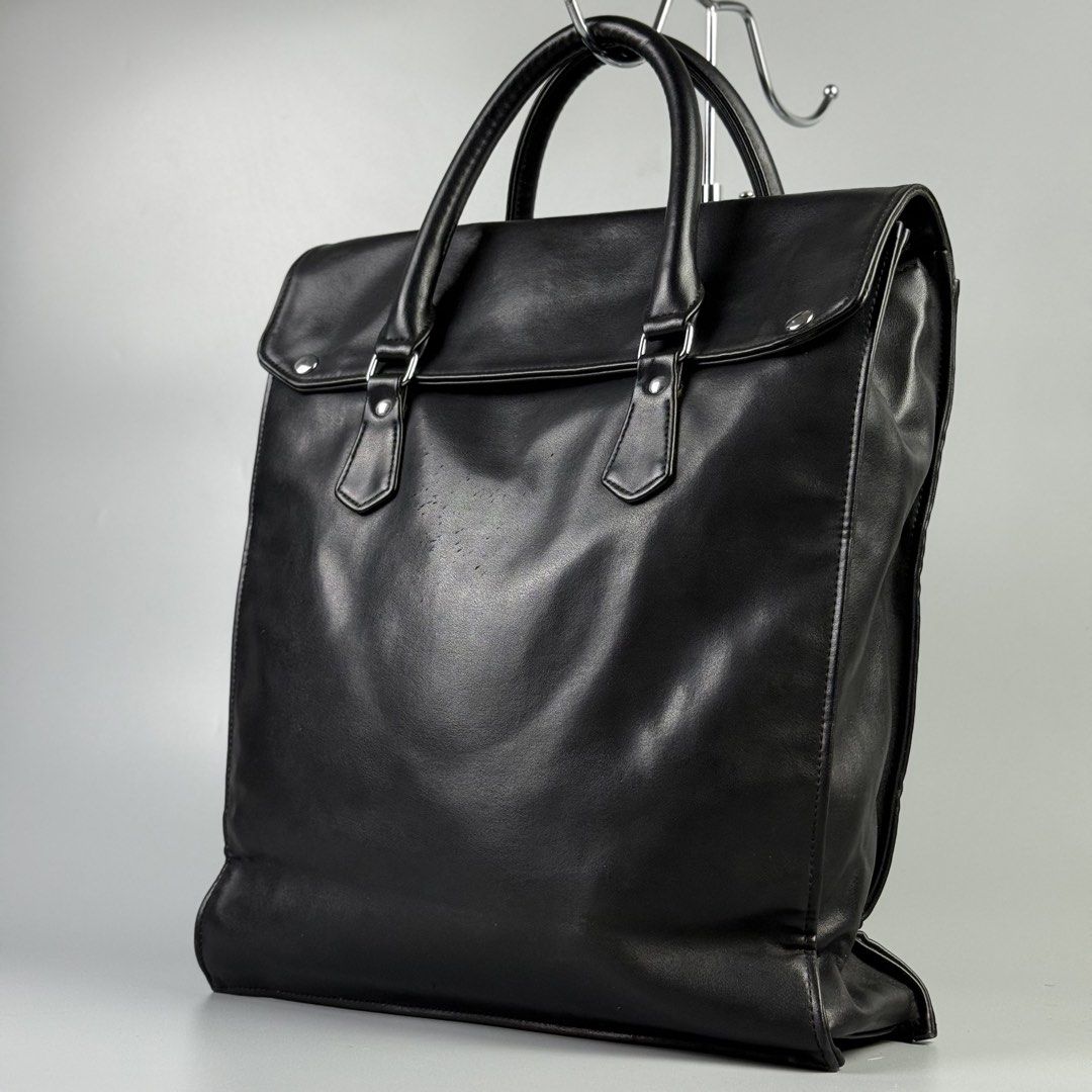 Comme des Garcons - Soft Leather Tote Bag (Category: Tote Bags) located in Pasig City. Submitted by on_the_trend (Listing ID 1452446049, Image 1). Description: Condition: 8/10 Flaw: Scuffs, Leather Pilling, Normal sign of usage Material: Soft leather Measurement: Width: 15 inches Height: 15.5 inches Depth: 4 inches.