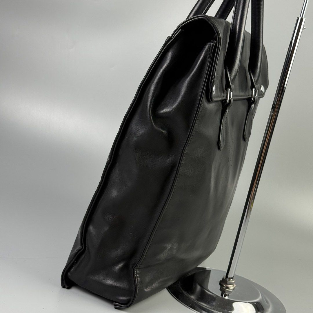 Comme des Garcons - Soft Leather Tote Bag (Category: Tote Bags) located in Pasig City. Submitted by on_the_trend (Listing ID 1452446049, Image 3). Description: Condition: 8/10 Flaw: Scuffs, Leather Pilling, Normal sign of usage Material: Soft leather Measurement: Width: 15 inches Height: 15.5 inches Depth: 4 inches.