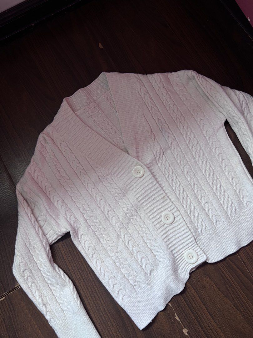 Cream Cable Knit Button Up Cardigan cute cozy comfy (Category: Coats, Jackets and Outerwear) located in Antipolo. Submitted by riesns (Listing ID 1452405775, Image 3). Description: - Cream cable knit cardigan - Long sleeves - V-neckline - Three button front closure - Cozy and comfortable feel - Ideal for layering over tops or dresses - Versatile wardrobe staple.