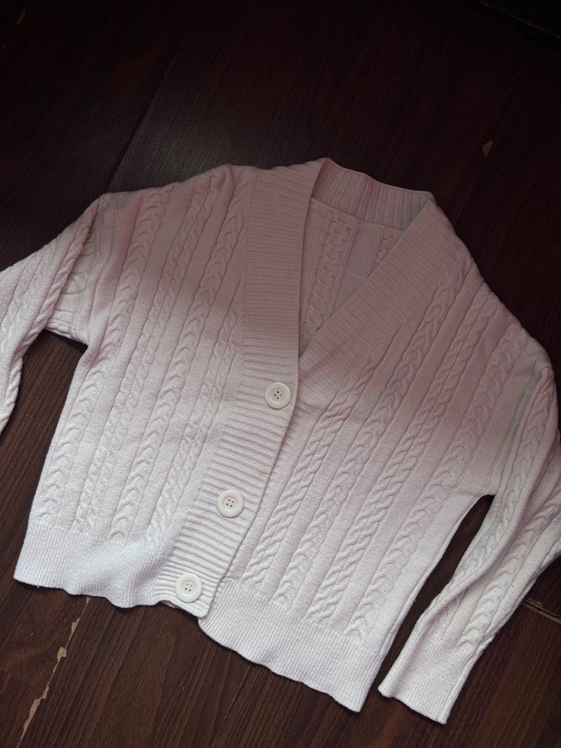 Cream Cable Knit Button Up Cardigan cute cozy comfy (Category: Coats, Jackets and Outerwear) located in Antipolo. Submitted by riesns (Listing ID 1452405775, Image 2). Description: - Cream cable knit cardigan - Long sleeves - V-neckline - Three button front closure - Cozy and comfortable feel - Ideal for layering over tops or dresses - Versatile wardrobe staple.