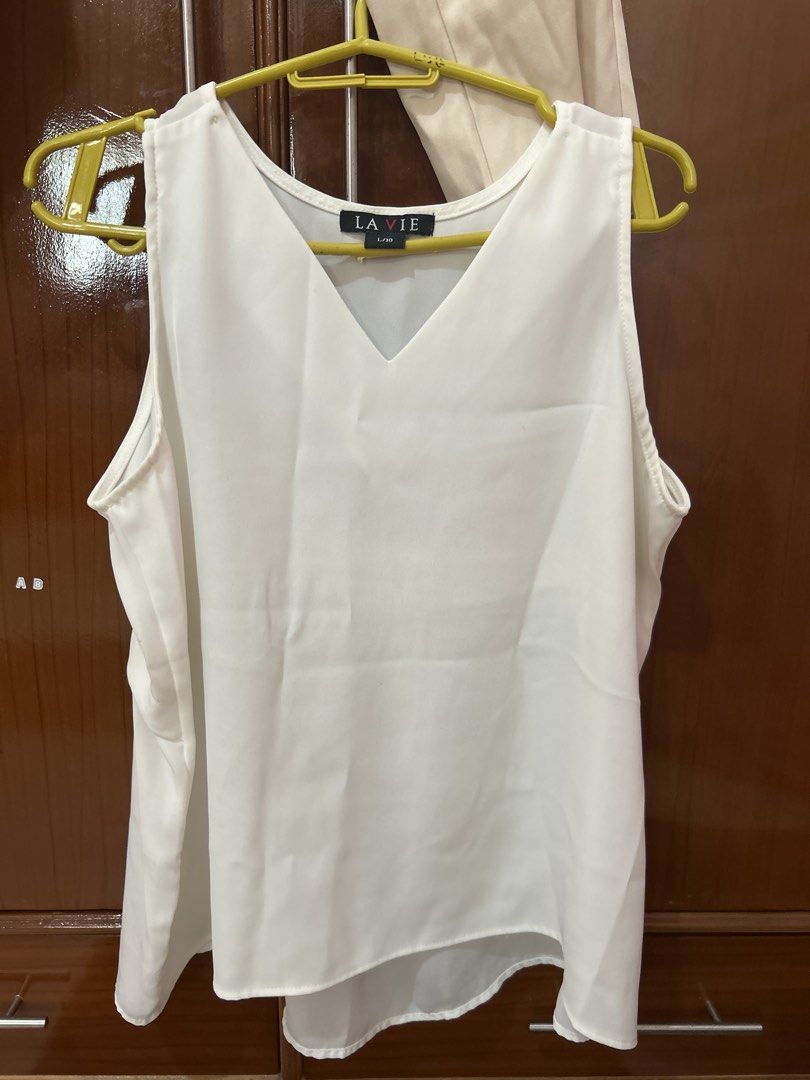 Cream Trousers and White V-Neck Top Set (Category: Sets or Coordinates) located in Cauayan City . Submitted by lenkapreloved (Listing ID 1452346196, Image 2). Description: - Cream colored trousers with button and zip closure - Straight leg cut - Simple white sleeveless V-neck top - Both pieces are versatile and can be worn together or separately - Suitable for casual or semi-formal occasions - Easy to mix and match with other wardrobe staples.