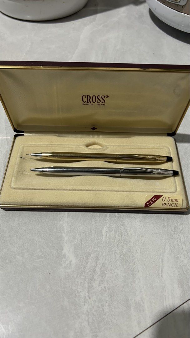 Cross Pen and Pencil Set in Original Box (Category: Stationery & School Supplies) located in San Fernando. Submitted by TheBTBs (Listing ID 1452427975, Image 2). Description: - Elegant Cross pen and 0.5mm mechanical pencil set. - Classic gold and silver finish. - Includes original Cross presentation box. - Ideal gift for those who appreciate fine writing instruments..