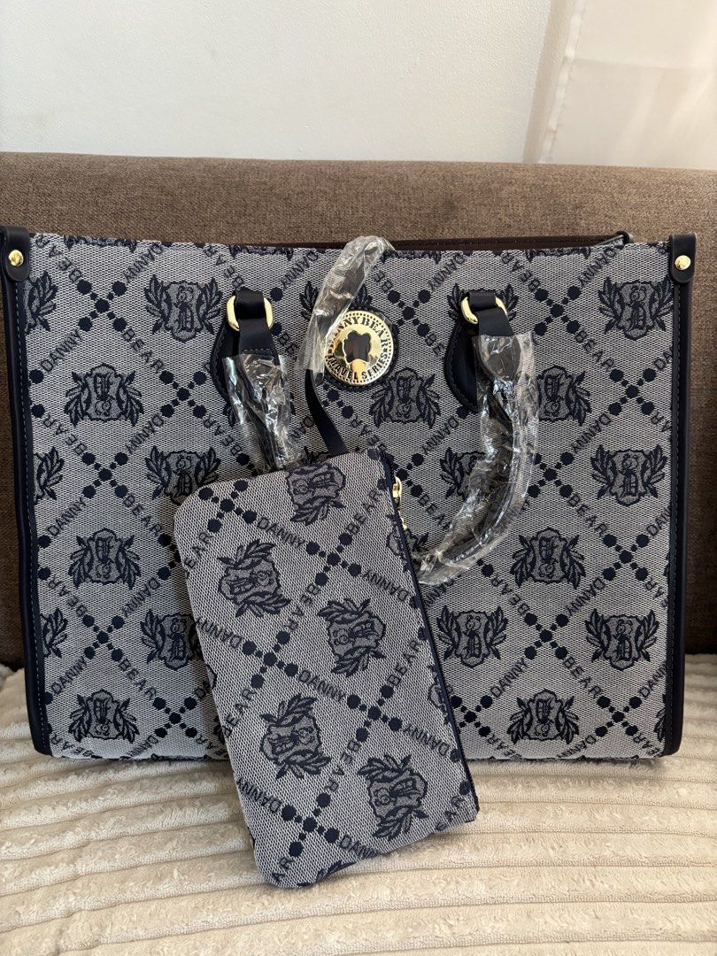 Danny Bear Monogram Tote Bag with Pouch (Category: Tote Bags) located in Mexico. Submitted by 3everything (Listing ID 1452419433, Image 2). Description: - Authentic Danny Bear tote bag - Features signature monogram pattern all over - Comes with a matching pouch - Interior is clean - Gold hardware details - Ideal for everyday use.