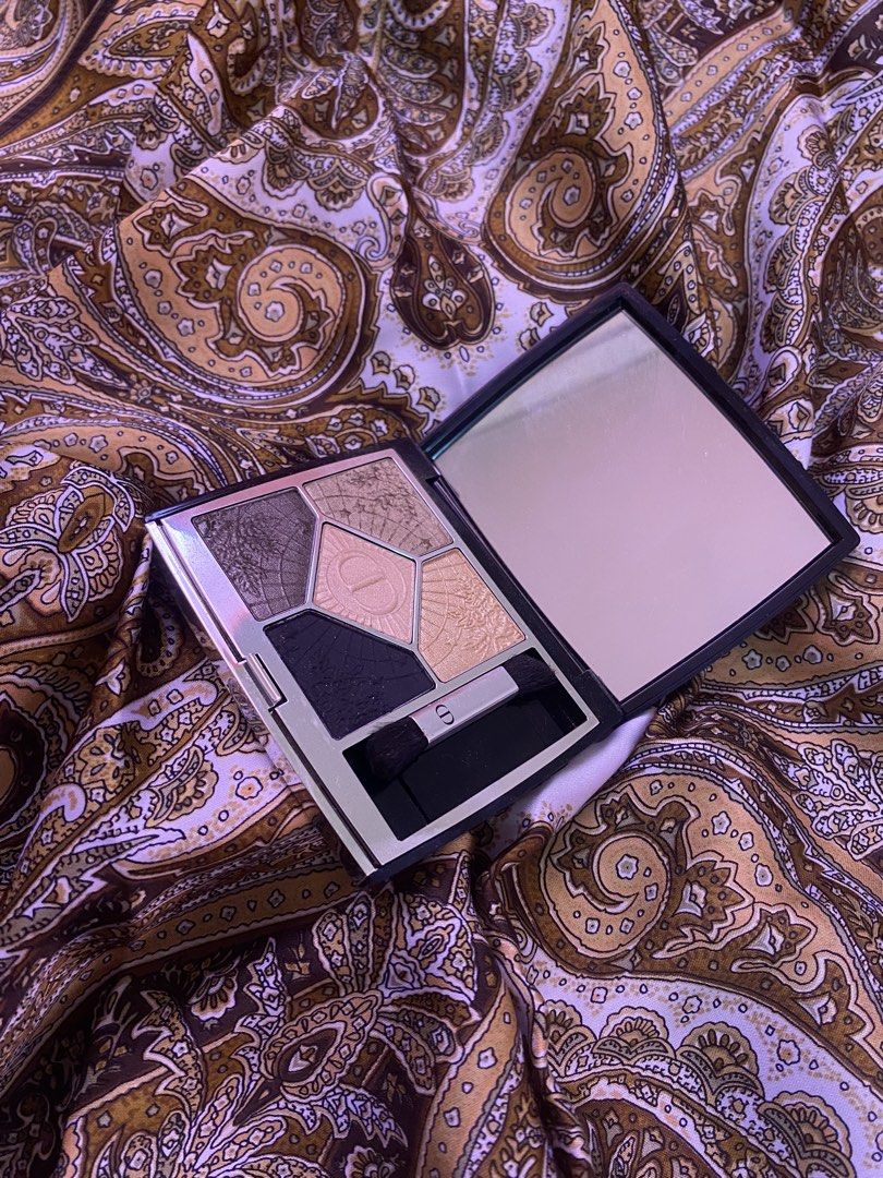 Dior 5 Couleurs Couture Eyeshadow Palette (Category: Makeup) located in Baguio. Submitted by xy_03 (Listing ID 1452330751, Image 1). Description: - Authentic Dior eyeshadow palette - Shade: 359 Cosmic Eyes - Includes applicator brush (one brush missing) - Features a built-in compact mirror - Ideal for creating various eye makeup looks Ps: Shipping Fee not included.