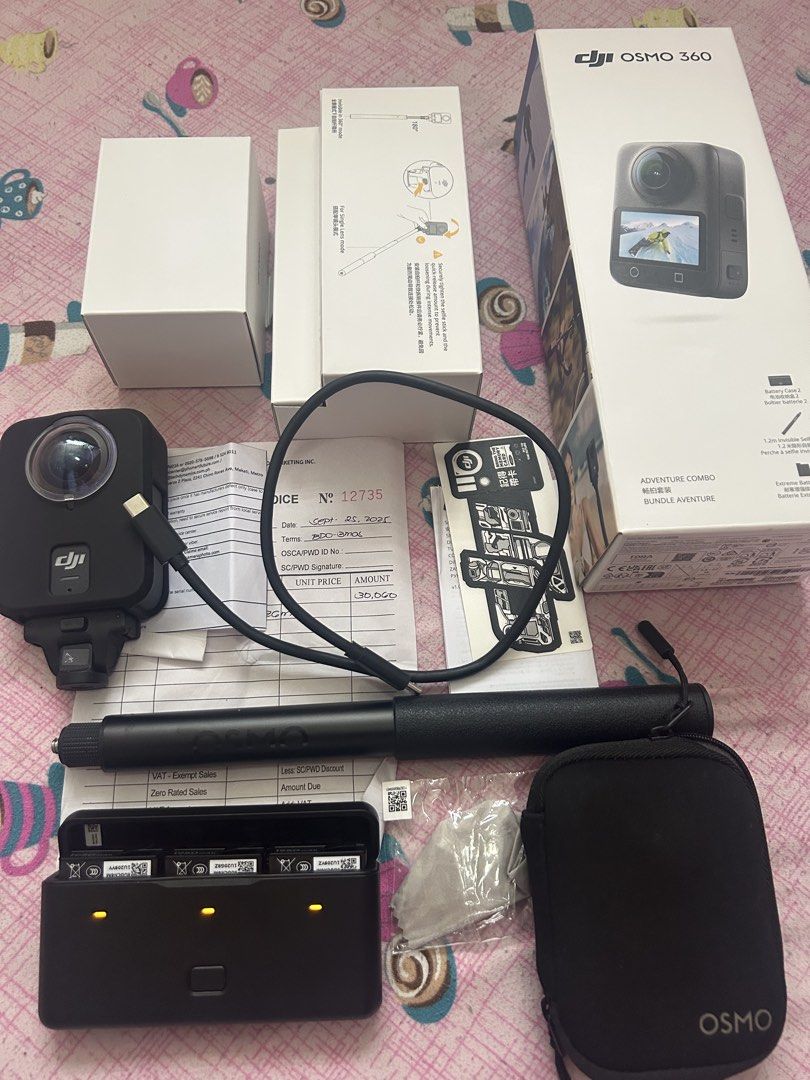 DJI Osmo 360 Action Camera Adventure Combo Bundle (Category: Cameras) located in Manila. Submitted by lottiepot (Listing ID 1452322004, Image 1). Description: - DJI Osmo 360 Adventure Combo - Perfect for immersive footage - Includes: Camera, Charging Dock, 3 Batteries, Selfie Stick, Carrying Case - All original packaging and manuals included.